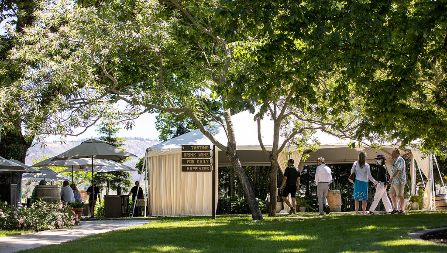 A couple of tents and patrons during a wine tasting event at Frank Family Vineyards