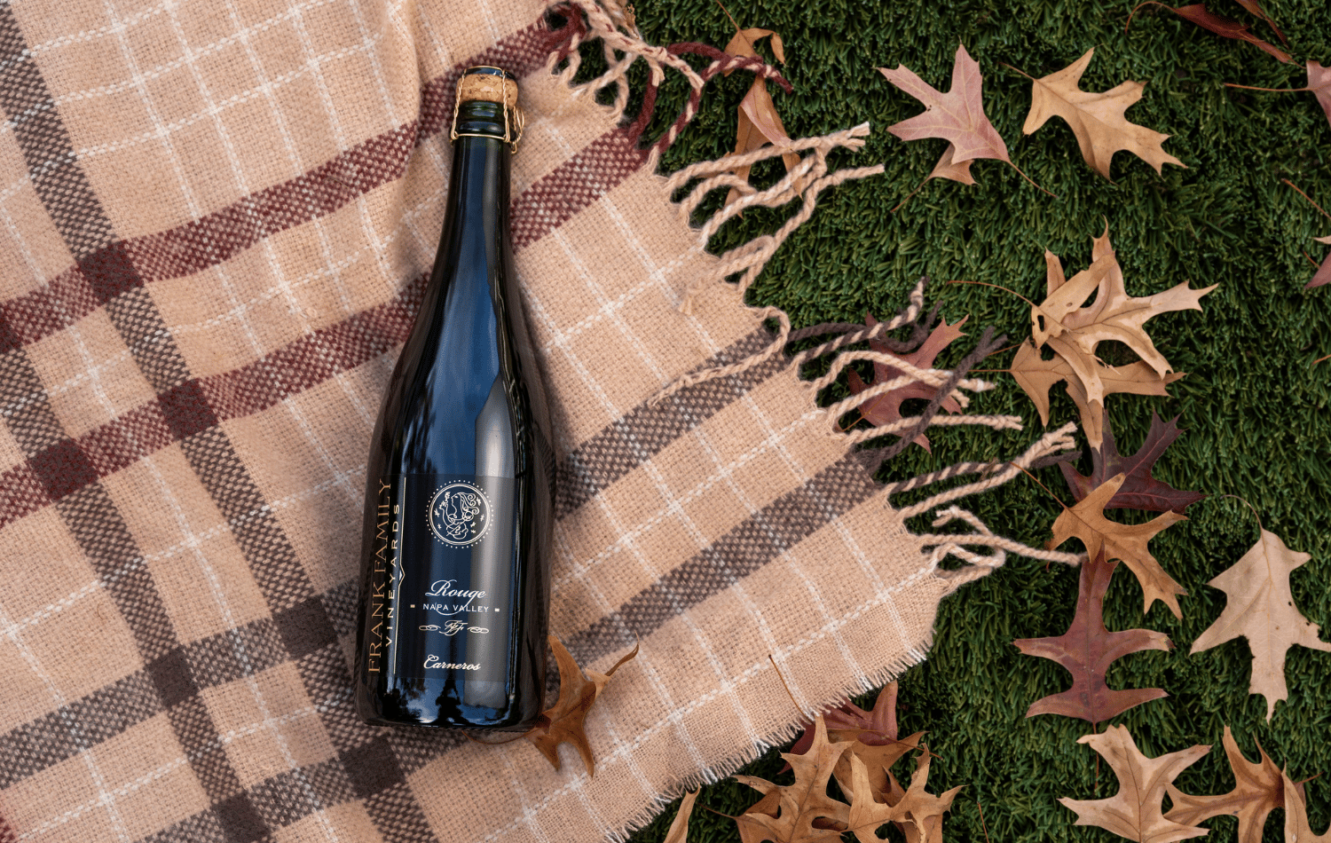 Frank Family Sparkling Rouge with a fall backdrop. 