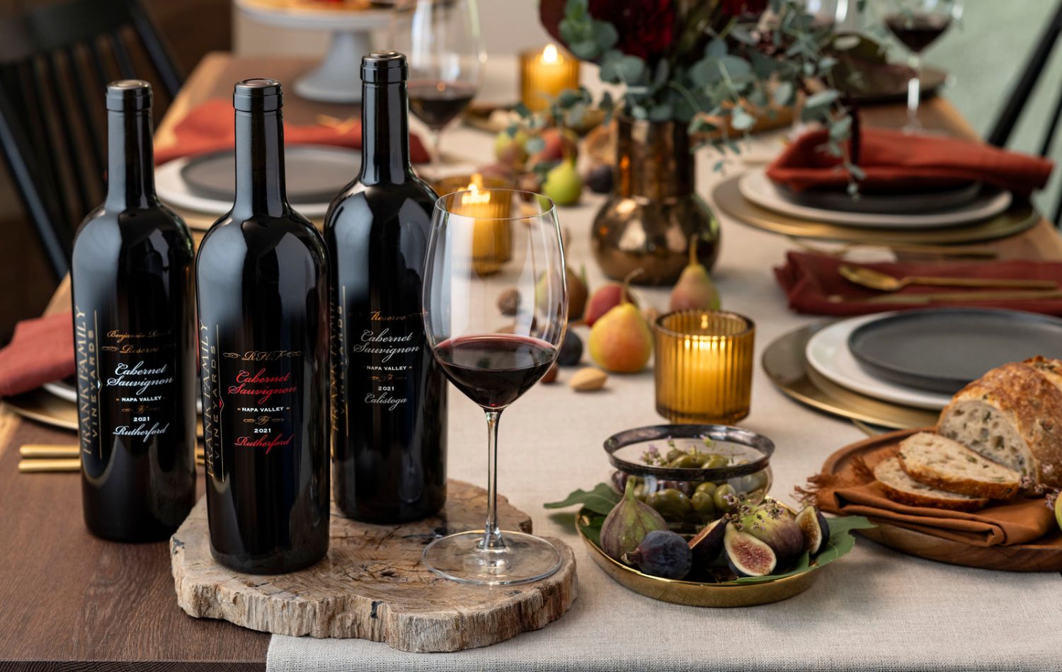 Three Frank Family wine club Cabernets on a festive holiday table