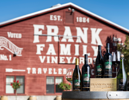 Frank Family wines in front of the iconic Frank Family red barn