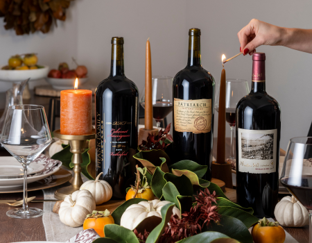 Bottles of Frank Family RHF, Patriarch, and Winston Hill Cabernet on a fall inspired tablescape. 